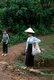 Vietnam: White Tai woman near Thuan Chau waiting for local transport, Son La Province, Northwest Vietnam